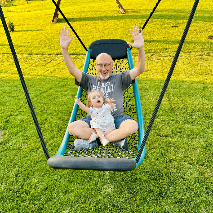 Carly swinging with Grandpa