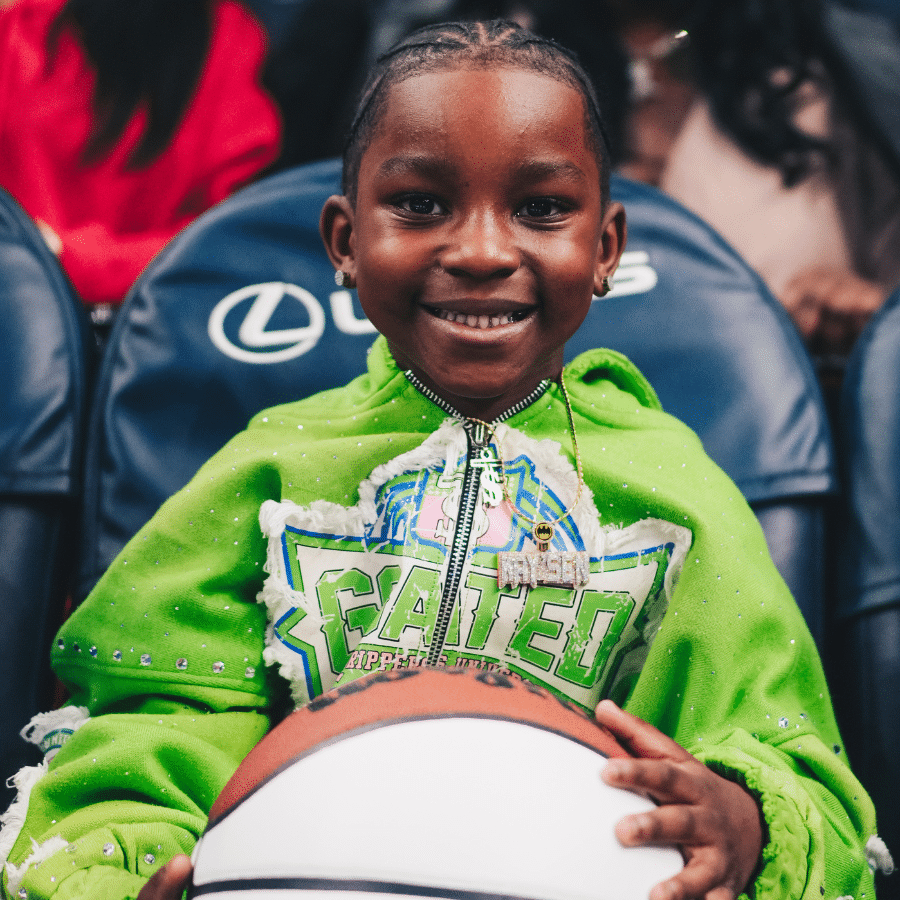 Kay'Sen smiling with a basketball