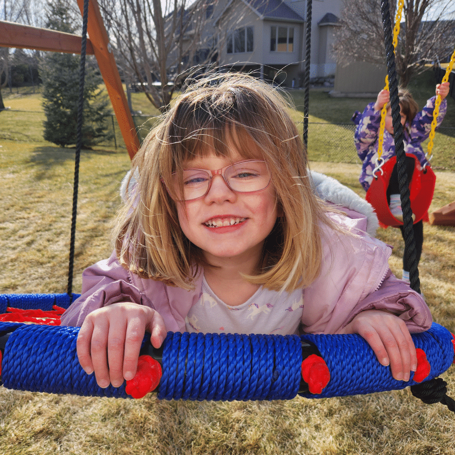 Emma on her swing