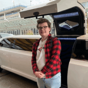 Jayse smiling by his limo escort to the airport